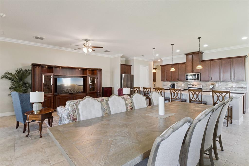 2665 Meadowedge Loop St. Cloud, FL 34772 - Photo 18 of 53 a living room with furniture and kitchen view