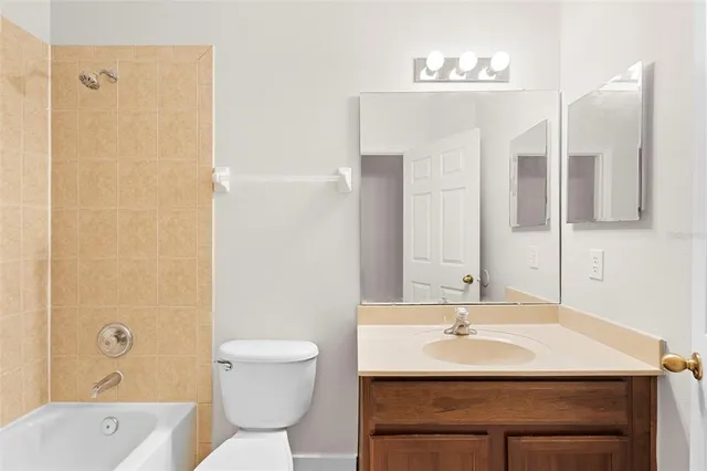 an empty room with wooden floor and a window