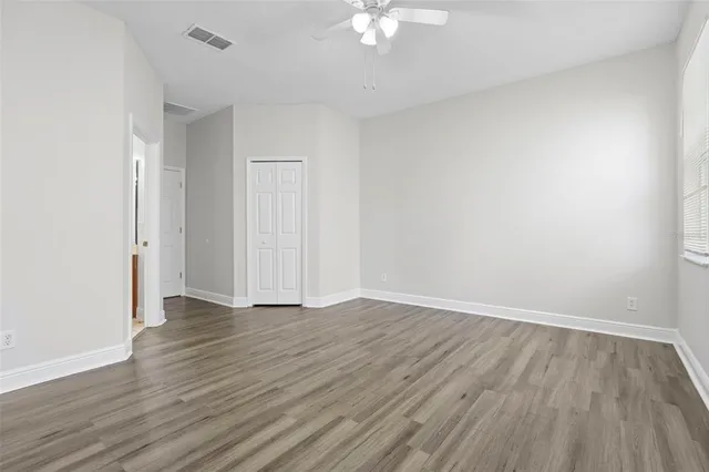 a bathroom with a bathtub shower sink mirror and toilet