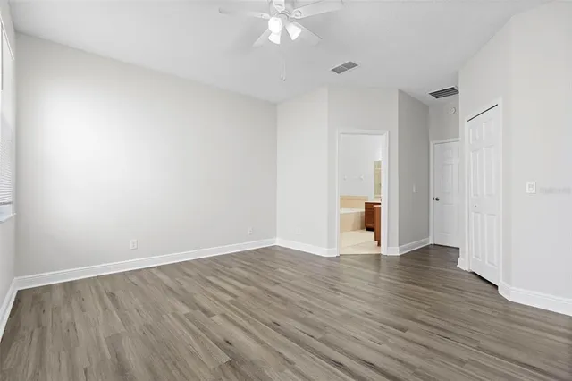 a bathroom with a granite countertop sink mirror bathtub and shower