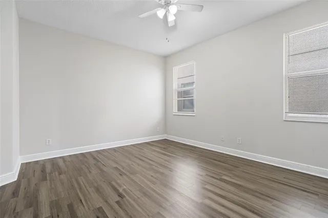 a bathroom with a tub sink toilet and mirror