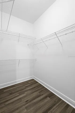 a view of a house with a small yard and plants