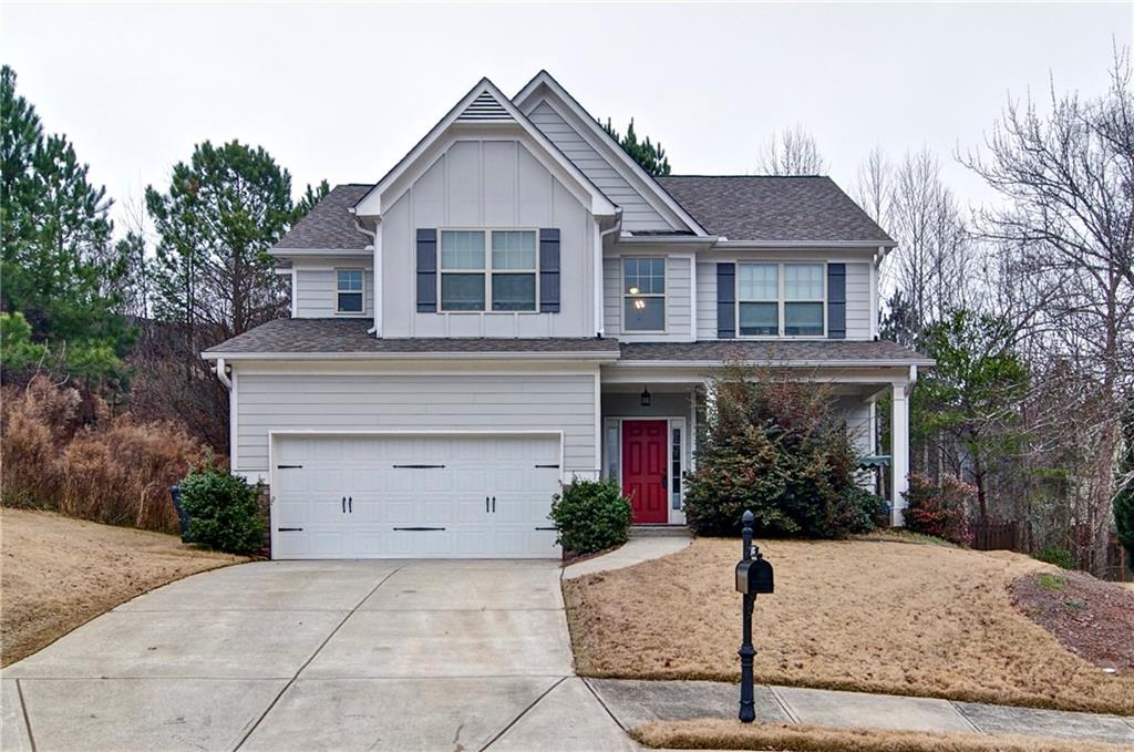 503 Pinnacle Court Canton, GA 30115 - Photo 1 of 1 a front view of a house with a yard and garage