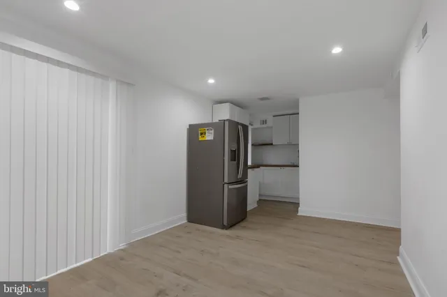 a view of a kitchen with a refrigerator