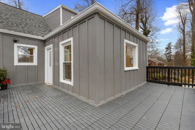 a view of a house with deck and wooden floor