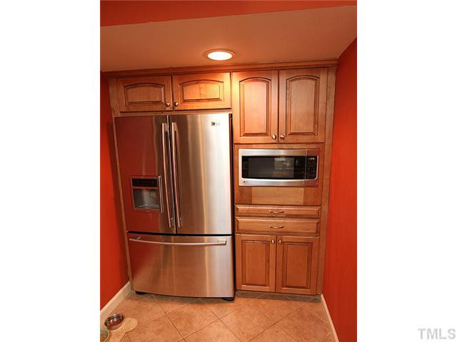 7819 Harps Mill Road Raleigh, NC 27615 - Photo 6 of 21 This gourmet kitchen offers plenty of cabinet and drawer space, plus a wonderful refrigerator and built-in wall microwave Kitchen