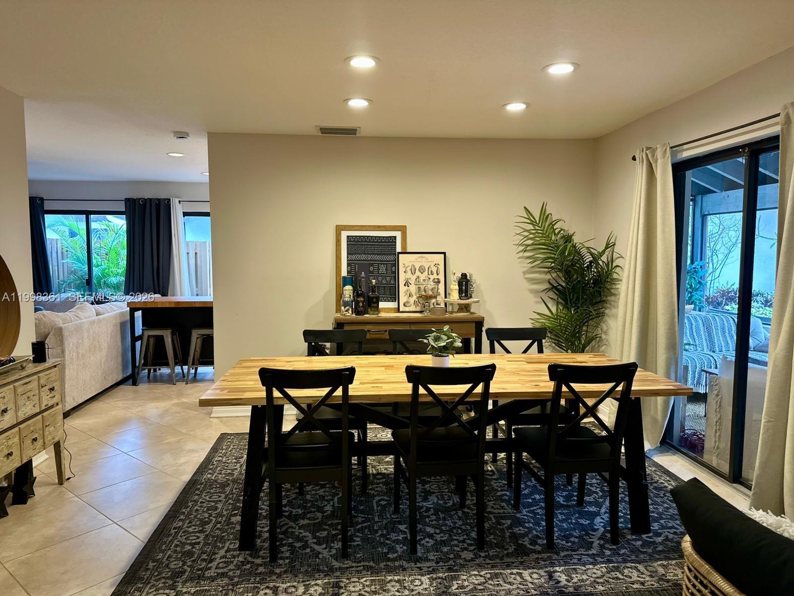 2089 Augusta Weston, FL 33326 - Photo 12 of 30 a view of a dining room with furniture