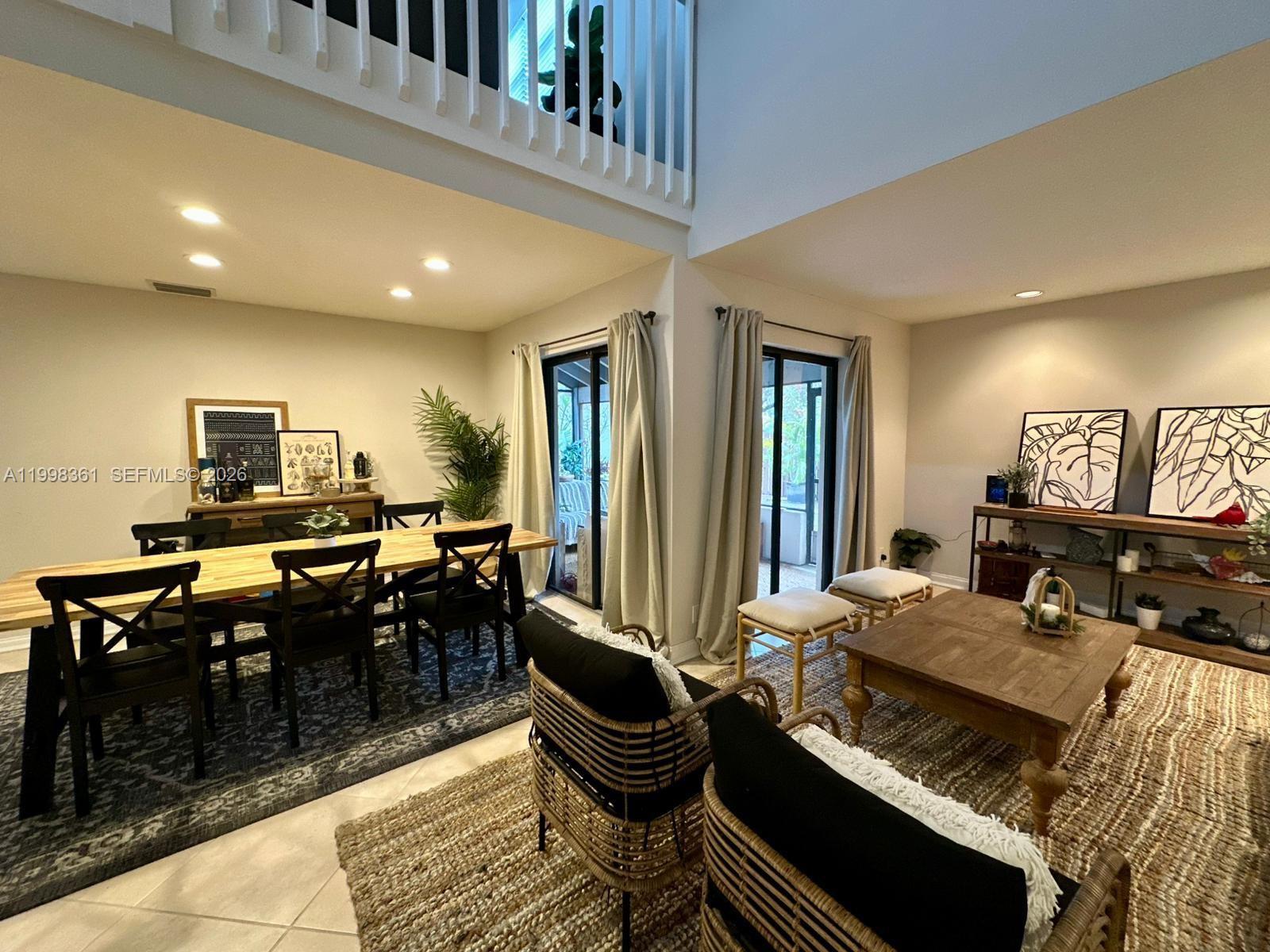 2089 Augusta Weston, FL 33326 - Photo 24 of 30 a living room with furniture a piano and a flat screen tv