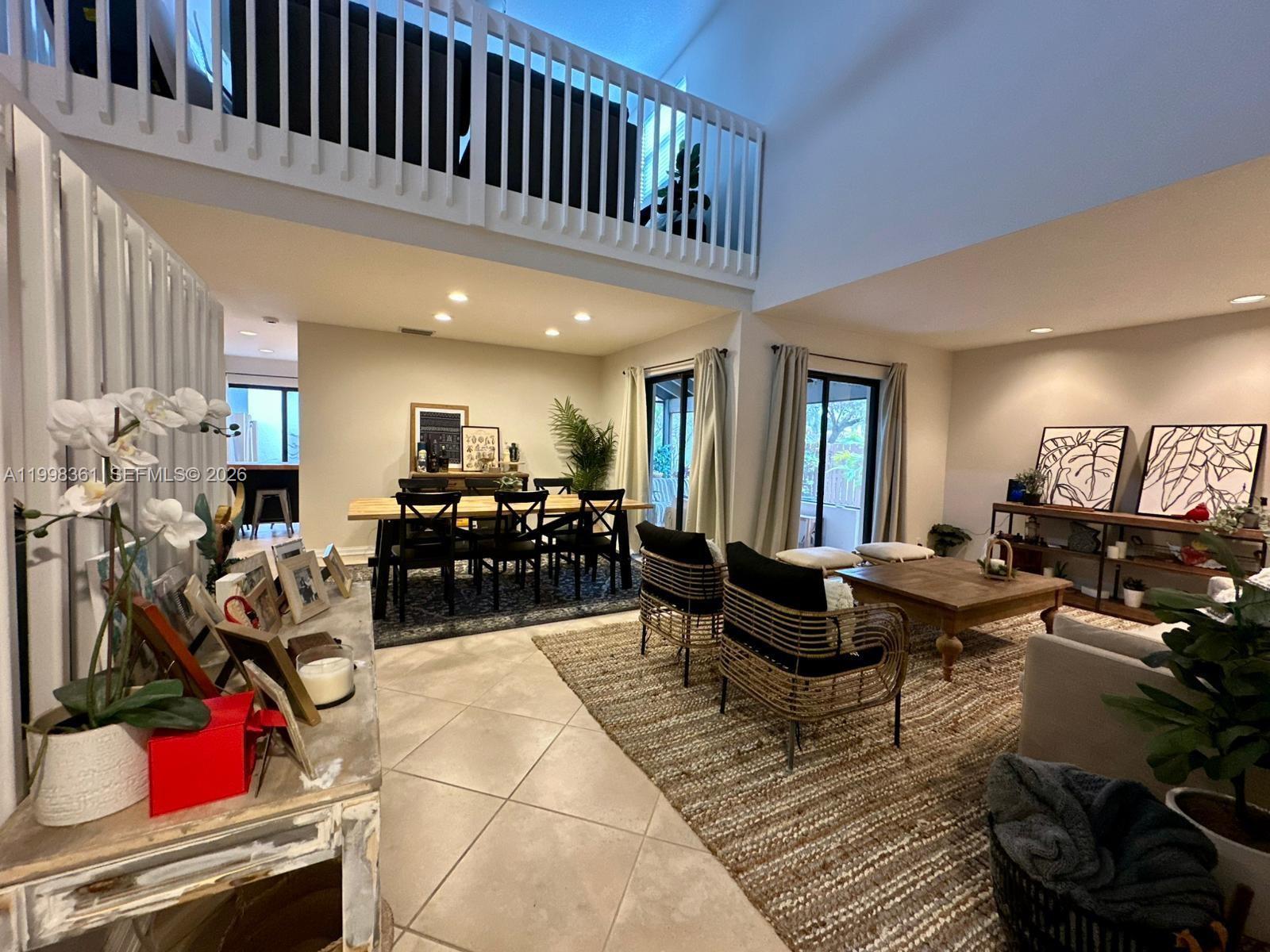 2089 Augusta Weston, FL 33326 - Photo 25 of 30 a living room with lots of furniture and gym equipment