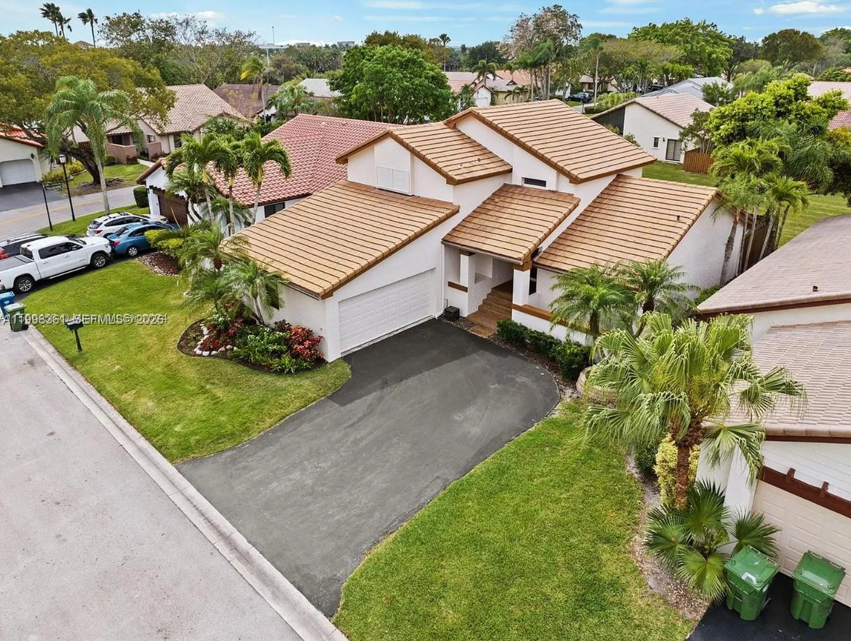 2089 Augusta Weston, FL 33326 - Photo 3 of 30 an aerial view of a house with a yard and lake view