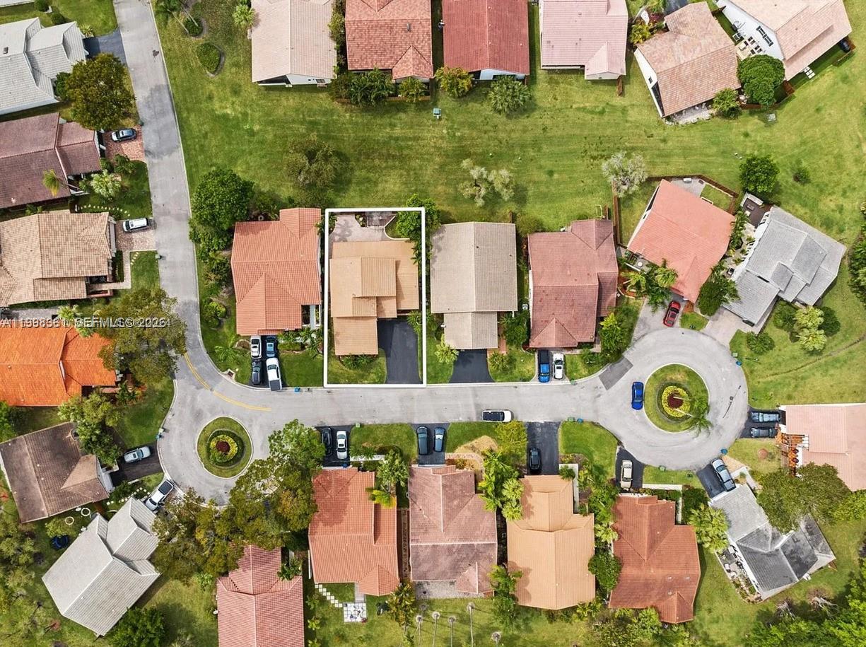 2089 Augusta Weston, FL 33326 - Photo 5 of 30 an aerial view of residential house with outdoor space and parking