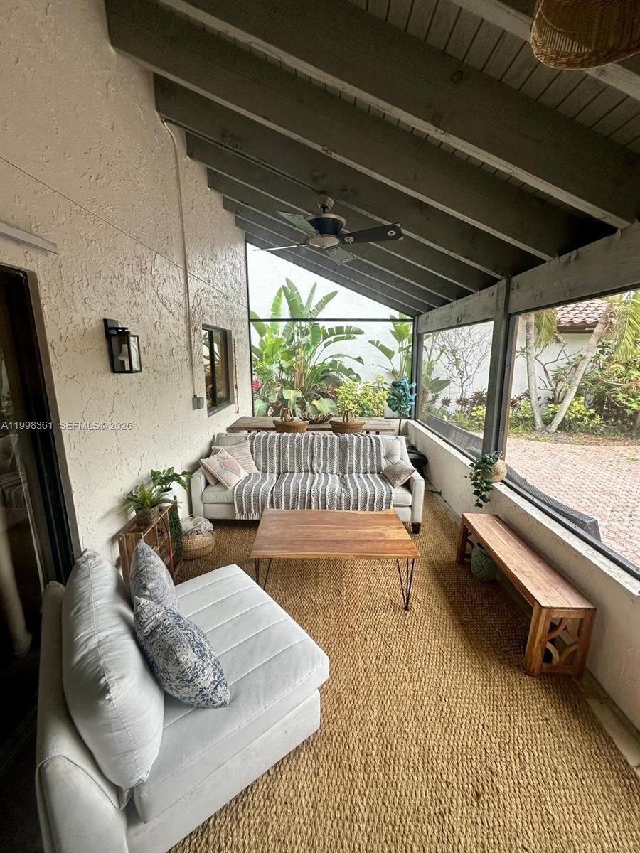 2089 Augusta Weston, FL 33326 - Photo 10 of 30 a living room with furniture and a floor to ceiling window