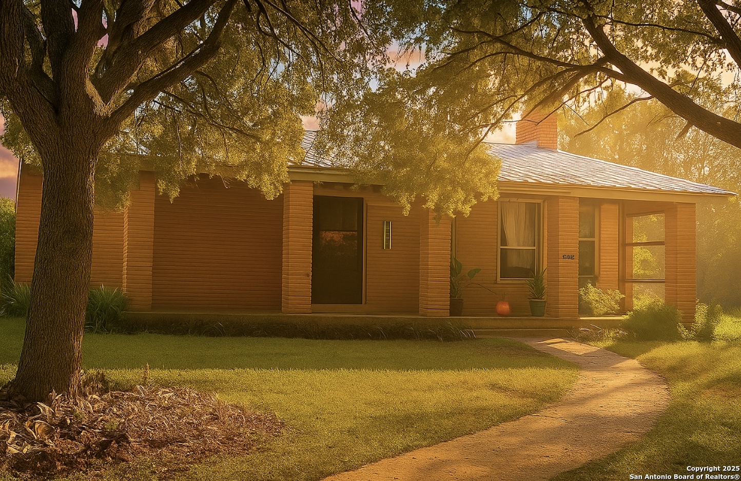 a view of yellow house with a large tree