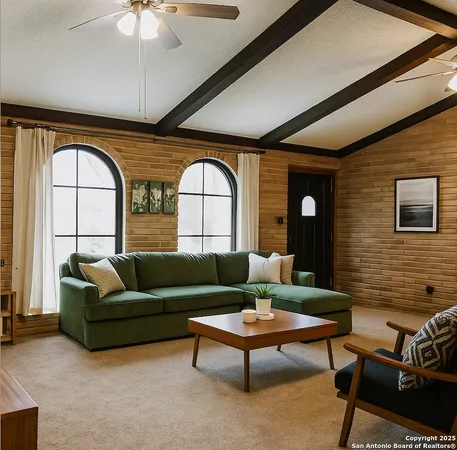 a living room with furniture and a large window