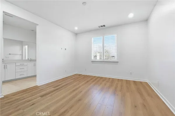 a bathroom with double sink and a mirror