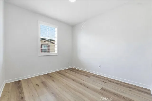 a bedroom with a bed a table and chair