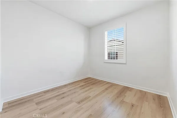a bedroom with a bed and a table in it