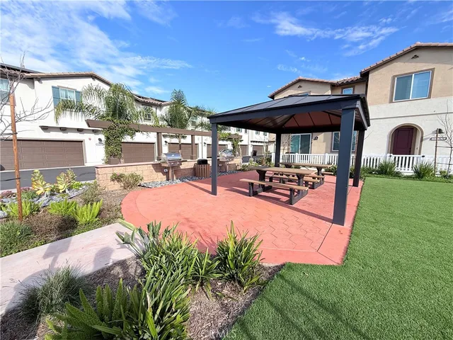 a view of a backyard with sitting area