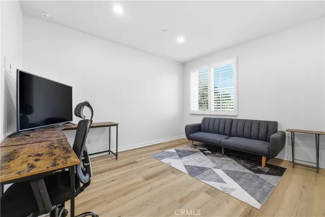 a view of a livingroom with furniture and window