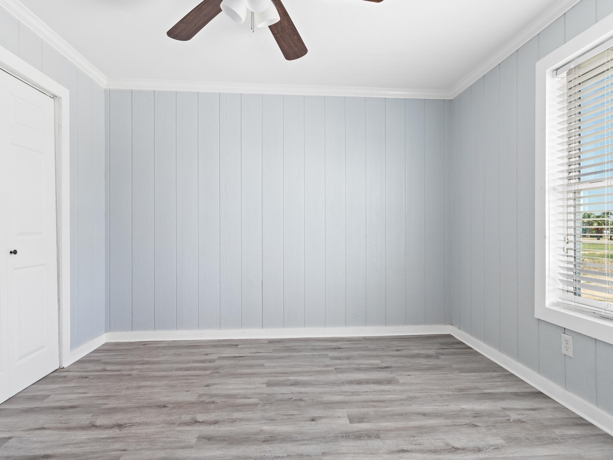 2055 State Highway 87 Crystal Beach, TX 77650 - Photo 20 of 32 wooden floor in an empty room with a window
