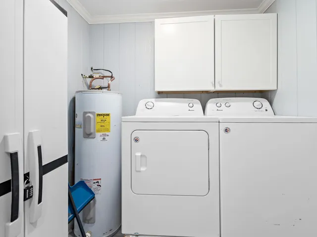 a bathroom with a granite countertop sink a vanity and a window