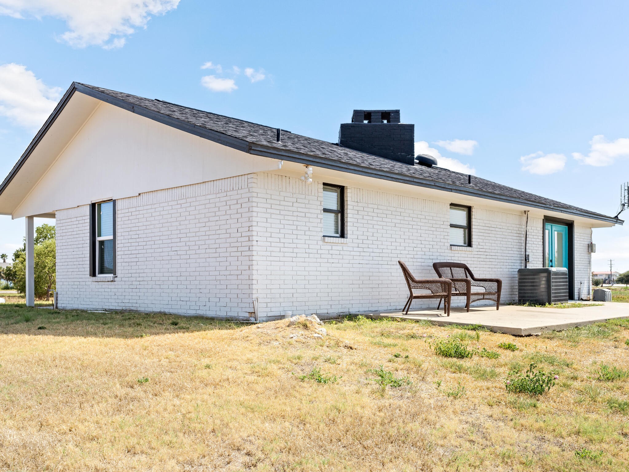 2055 State Highway 87 Crystal Beach, TX 77650 - Photo 23 of 32 a backyard of a house with table and chairs