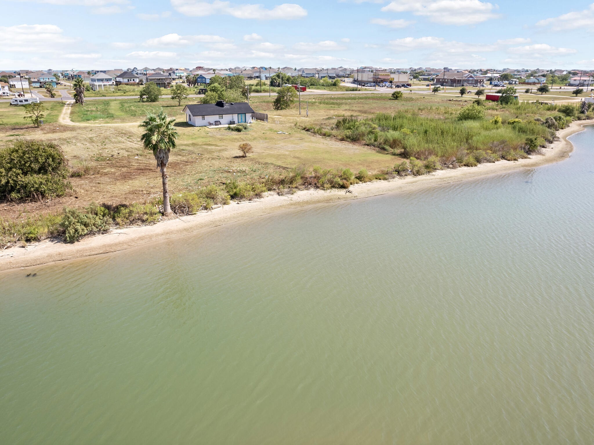 2055 State Highway 87 Crystal Beach, TX 77650 - Photo 26 of 32 a view of a lake with a city