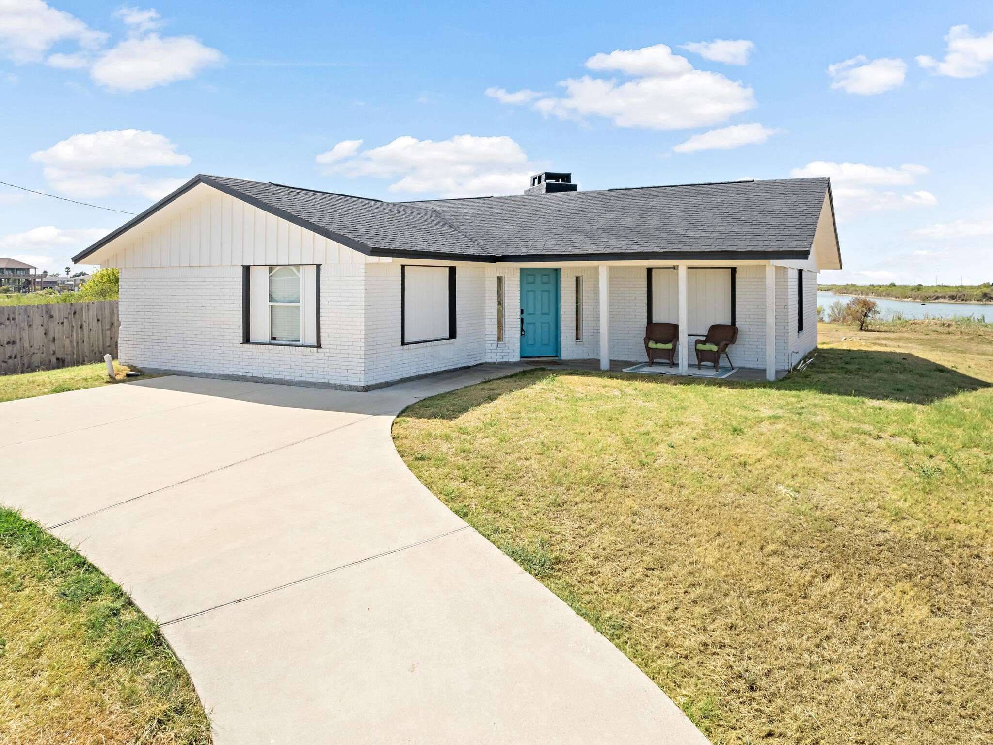 2055 State Highway 87 Crystal Beach, TX 77650 - Photo 30 of 32 a view of a house with pool and a yard