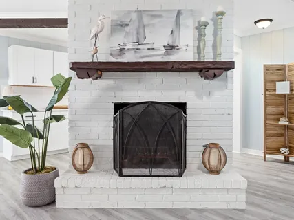 a view of living room with furniture and fireplace