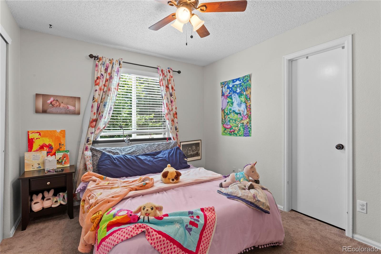 2212 Hyacinth Road Littleton, CO 80129 - Photo 25 of 44 a bedroom with bed and window