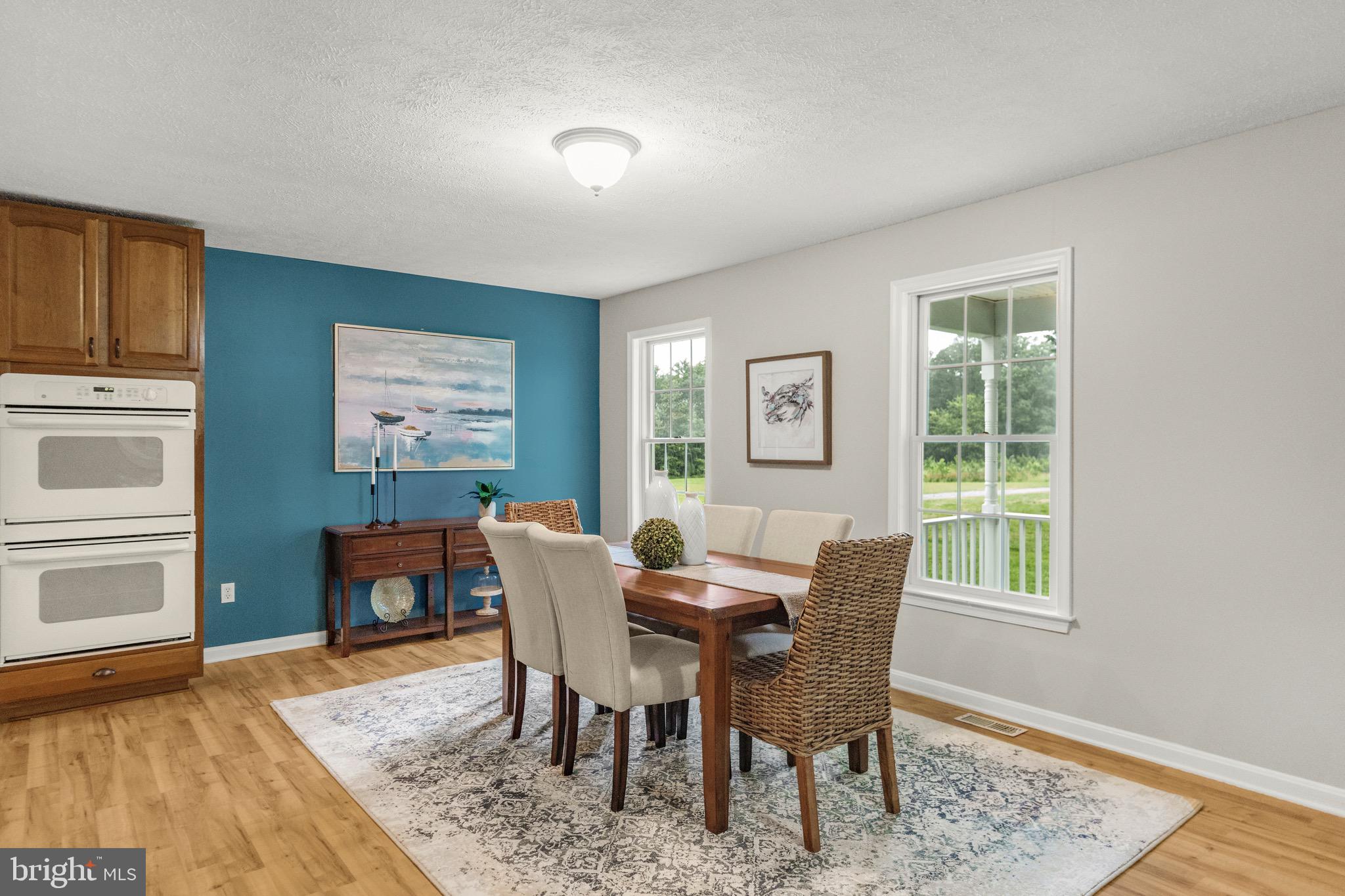 21549 Point Lookout Road Callaway, MD 20620 - Photo 11 of 41 a dining room with furniture and wooden floor