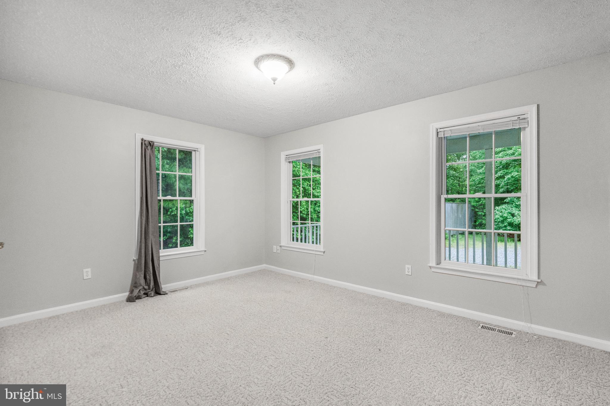 21549 Point Lookout Road Callaway, MD 20620 - Photo 25 of 41 an empty room with windows