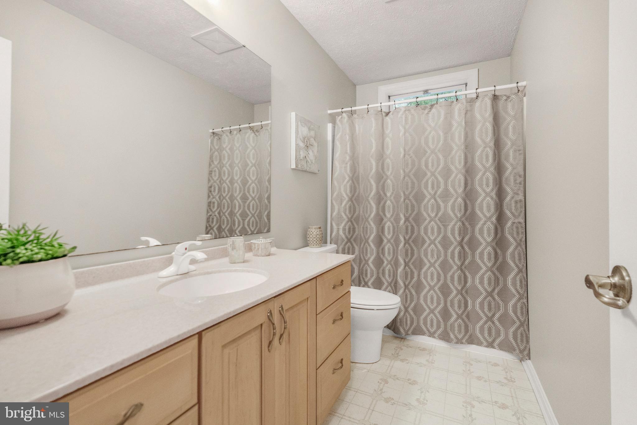 21549 Point Lookout Road Callaway, MD 20620 - Photo 26 of 41 a bathroom with a sink toilet and shower