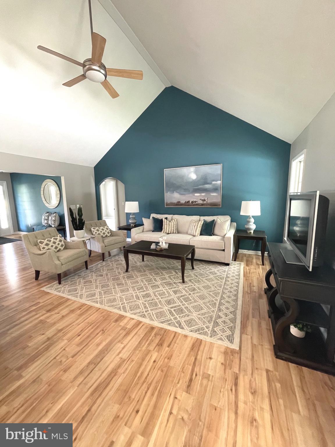 21549 Point Lookout Road Callaway, MD 20620 - Photo 31 of 41 a living room with furniture and a wooden floor