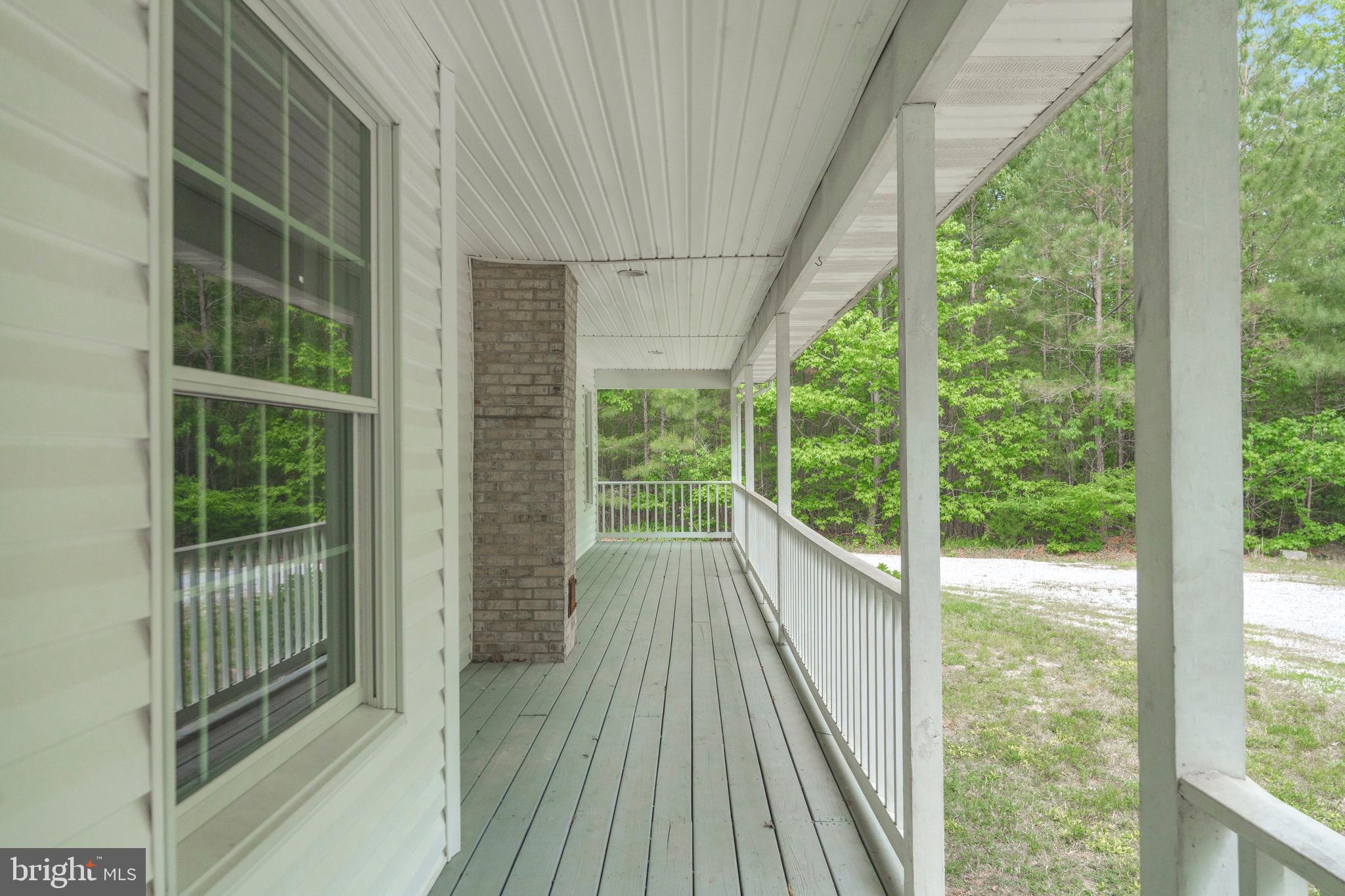 21549 Point Lookout Road Callaway, MD 20620 - Photo 34 of 41 a view of a room with wooden floor and windows