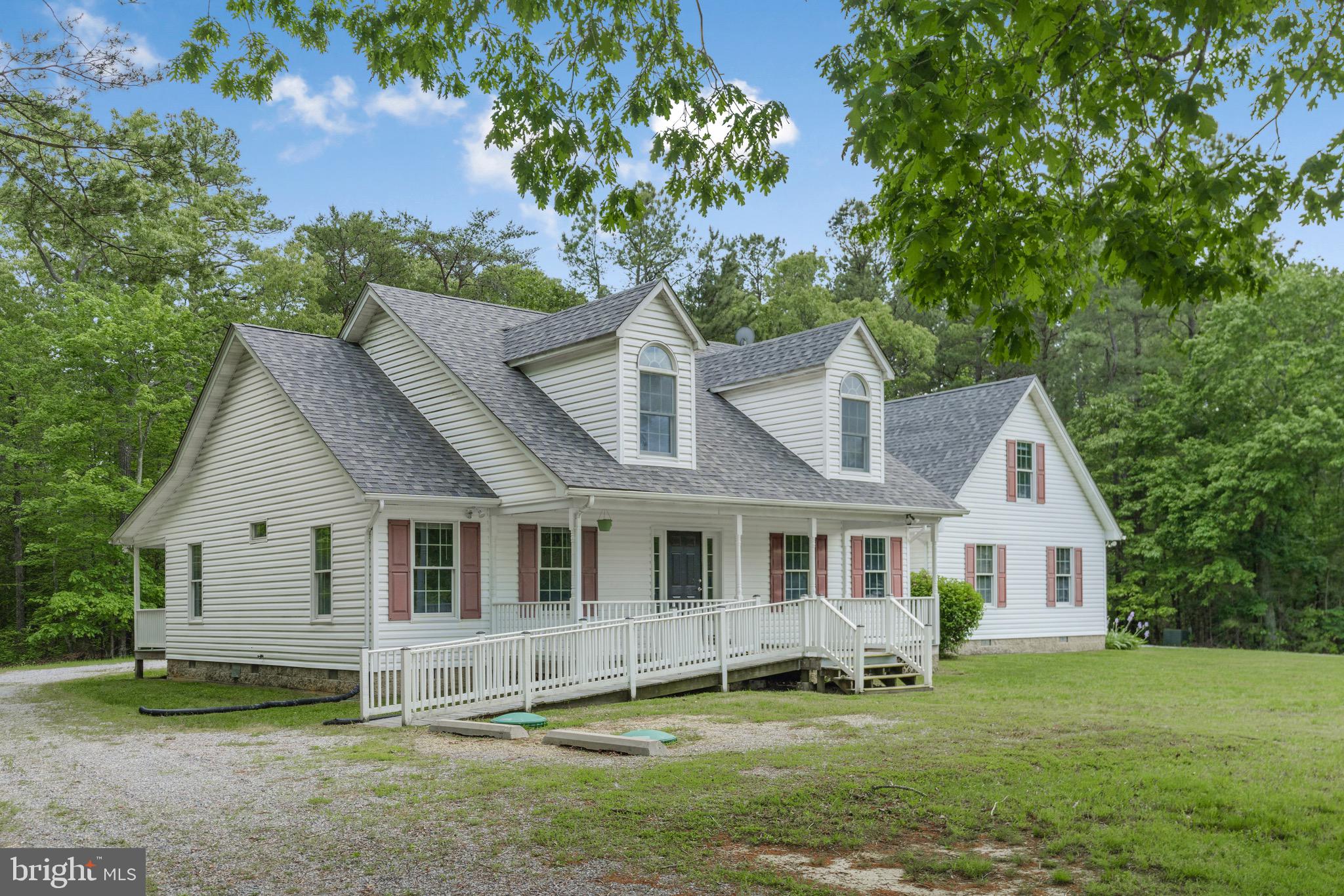 21549 Point Lookout Road Callaway, MD 20620 - Photo 35 of 41 a front view of a house with a garden