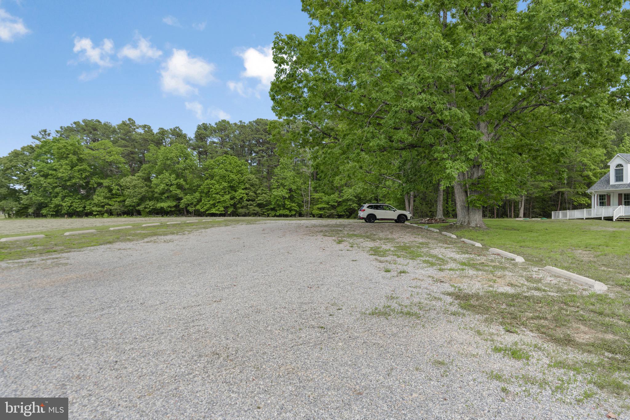 21549 Point Lookout Road Callaway, MD 20620 - Photo 36 of 41 a view of a field with trees in the background