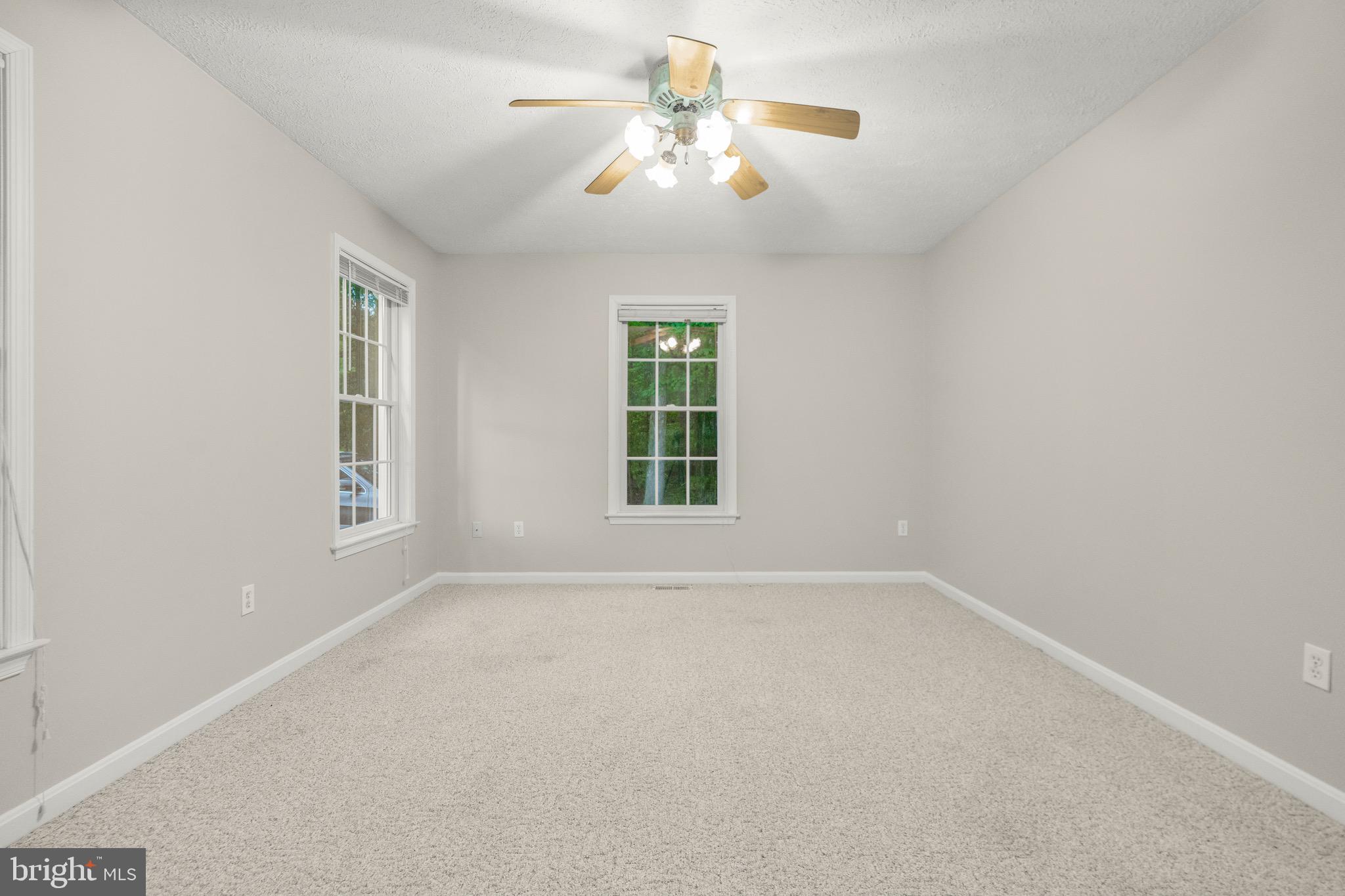 21549 Point Lookout Road Callaway, MD 20620 - Photo 37 of 41 a view of a room with windows and ceiling fan