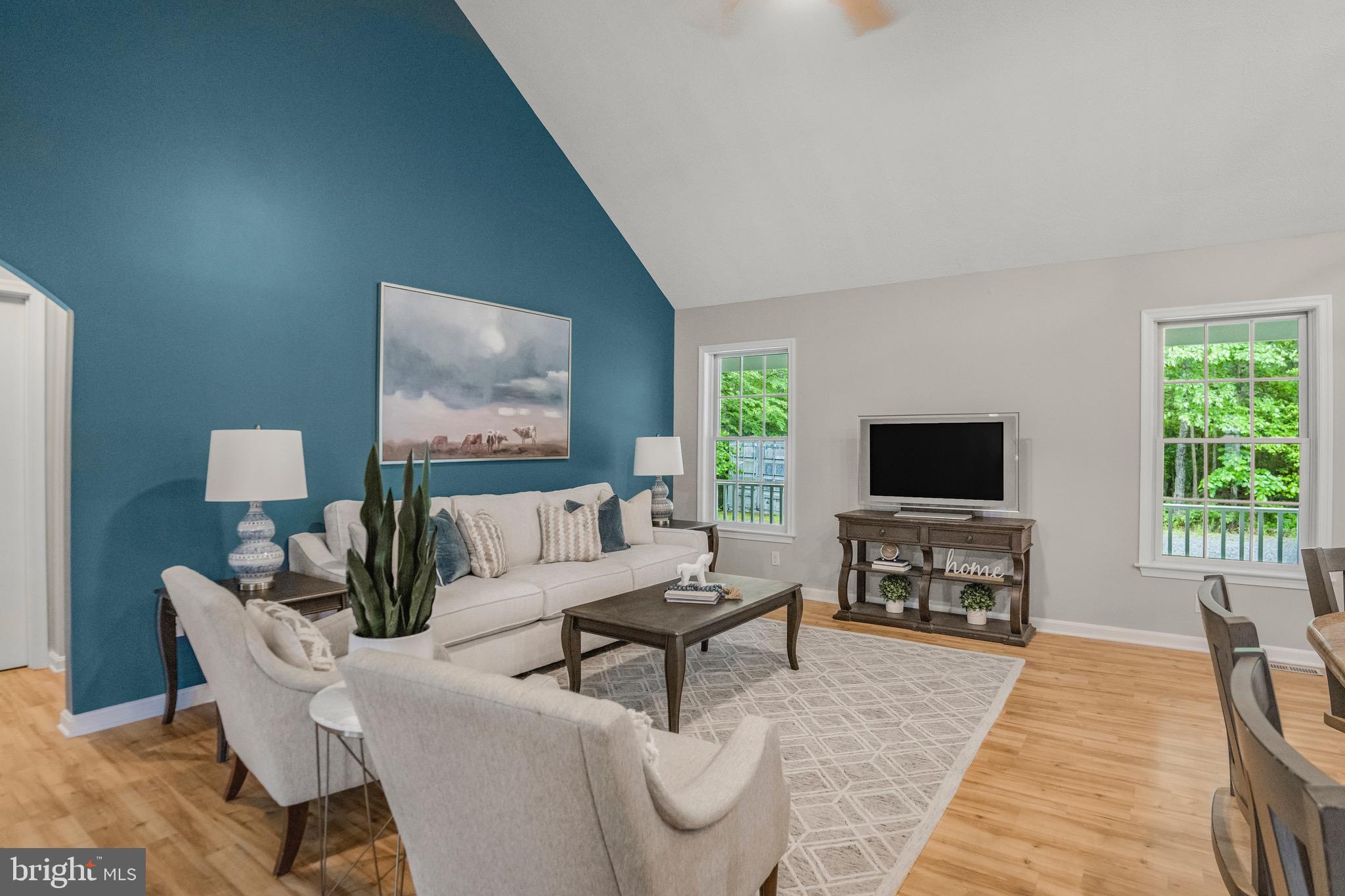 21549 Point Lookout Road Callaway, MD 20620 - Photo 10 of 41 a living room with furniture and a flat screen tv