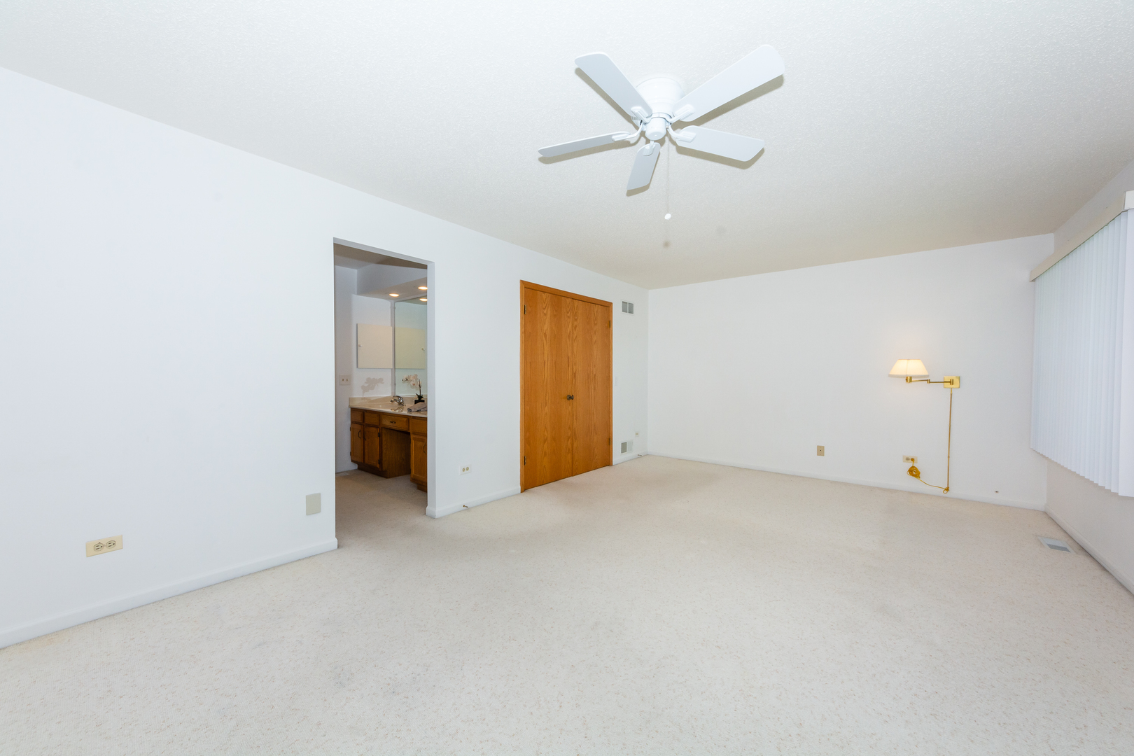 4510 Deer Trail Northbrook, IL 60062 - Photo 23 of 44 a view of an empty room with a ceiling fan
