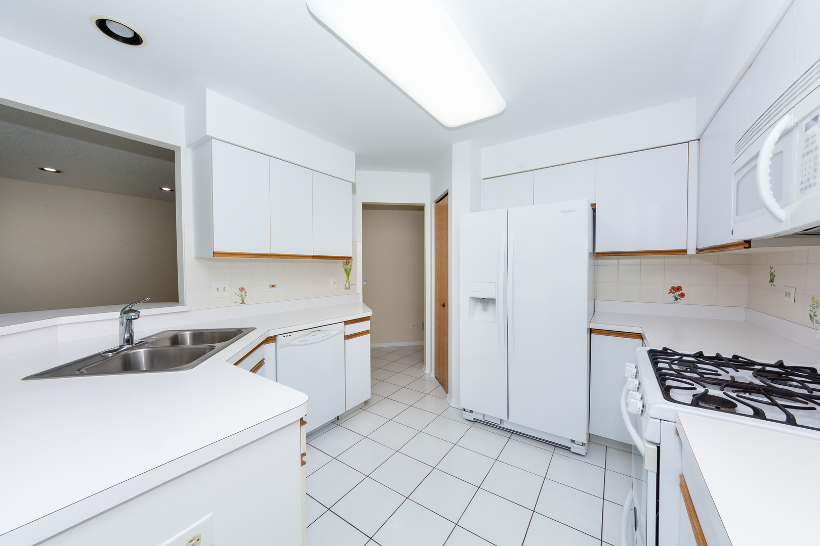 4510 Deer Trail Northbrook, IL 60062 - Photo 10 of 44 a kitchen with a sink a stove and refrigerator