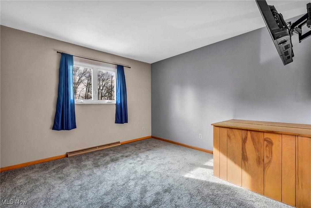 3673 Oak Road Stow, OH 44224 - Photo 11 of 20 Carpeted empty room featuring baseboards and baseboard heating