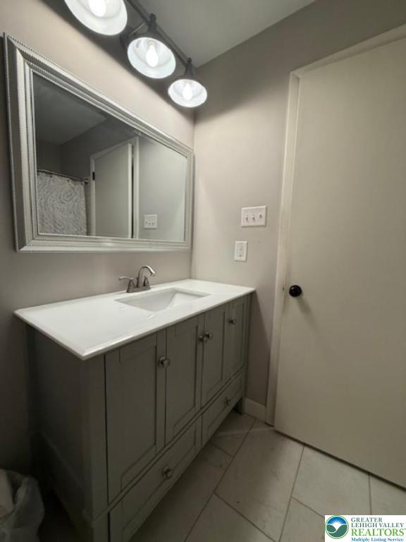 1626 3rd Street Bethlehem, PA 18020 - Photo 8 of 52 a bathroom with a sink vanity and a mirror