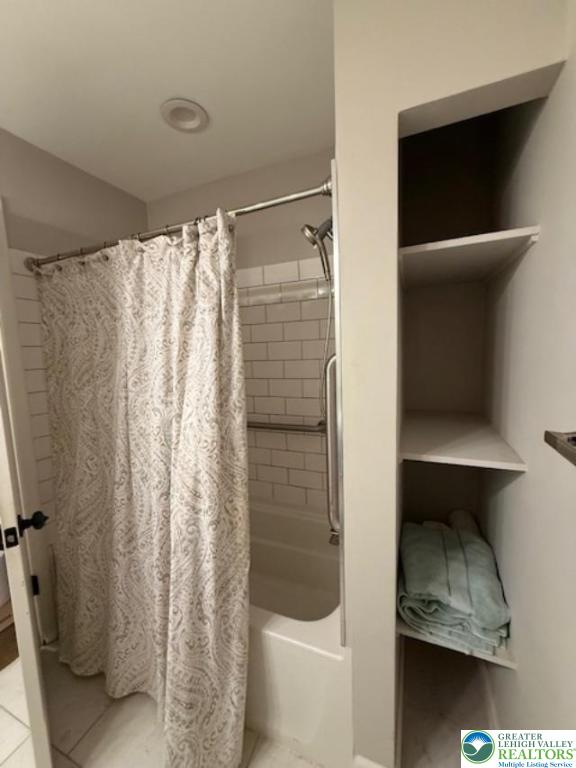 1626 3rd Street Bethlehem, PA 18020 - Photo 9 of 52 a bathroom with a shower curtain and a sink