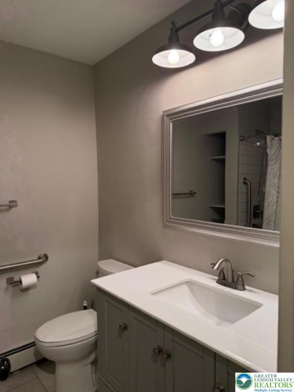 1626 3rd Street Bethlehem, PA 18020 - Photo 10 of 52 a bathroom with a granite countertop sink and a mirror