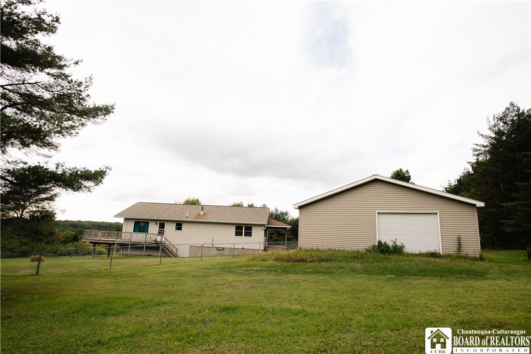 2599 Reynolds Road Farmersville, NY 14737 - Photo 12 of 44 Back side of garage - side lawn