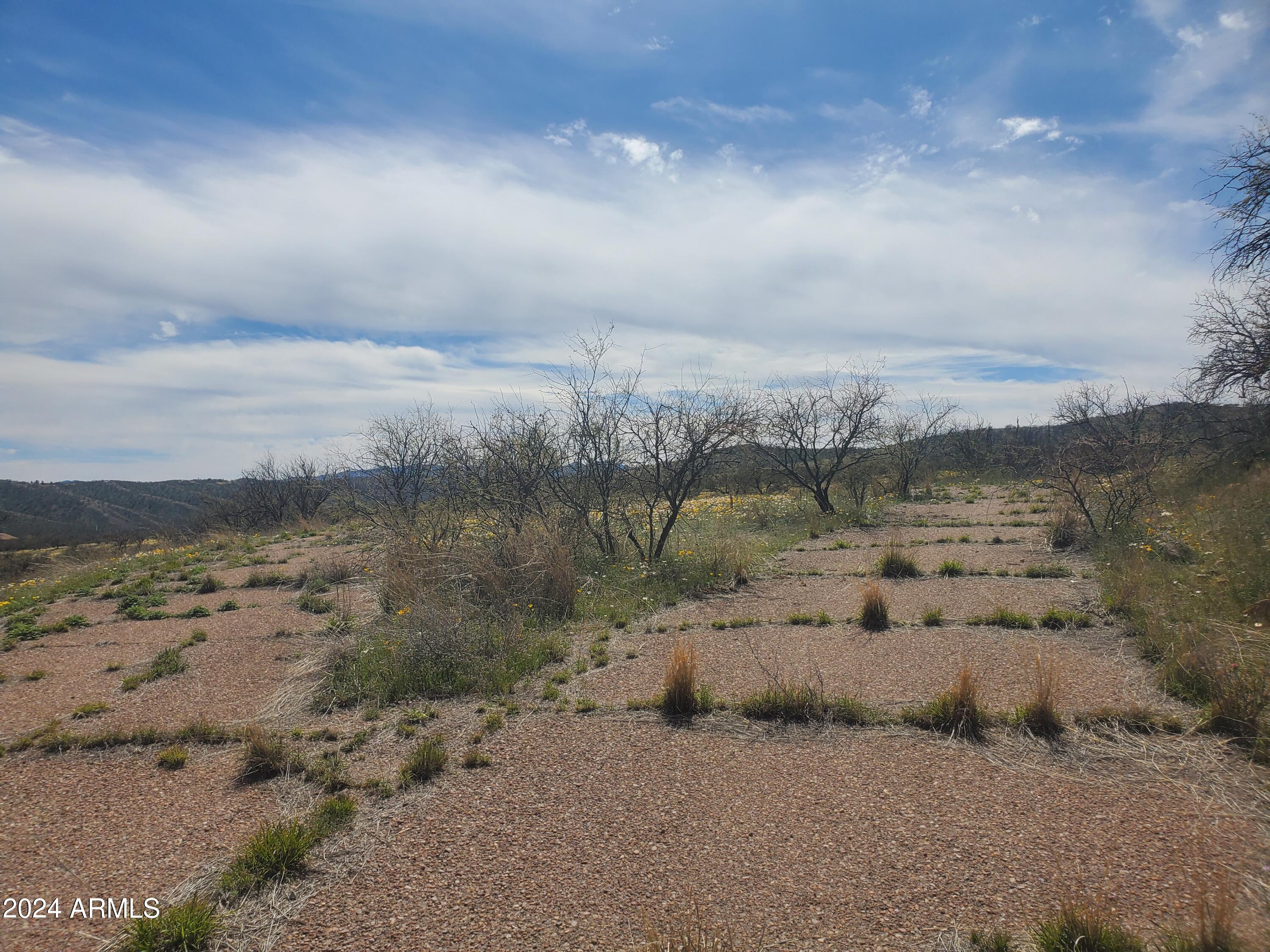 1140 Humberto Court, Unit 23 Rio Rico, AZ 85648 - Photo 7 of 10 a view of a lake with a mountain