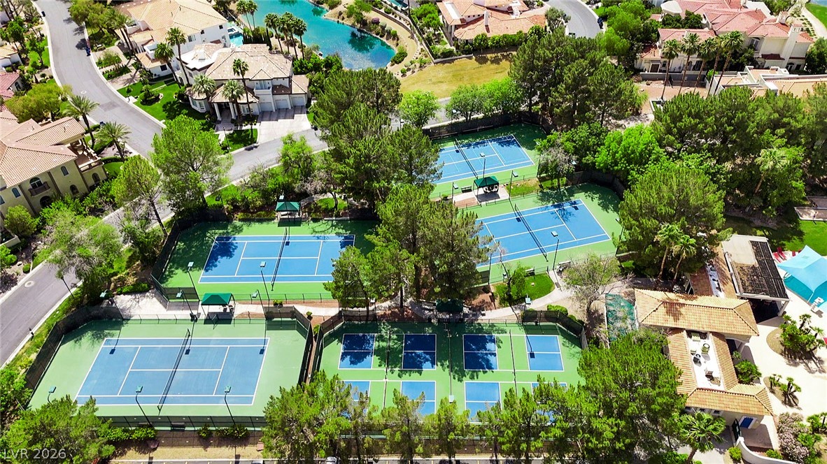 8981 Rivers Edge Drive Las Vegas, NV 89117 - Photo 62 of 69 Sporting amenities abound with numerous pickle ball and tennis courts nestled amidst a verdant landscape.