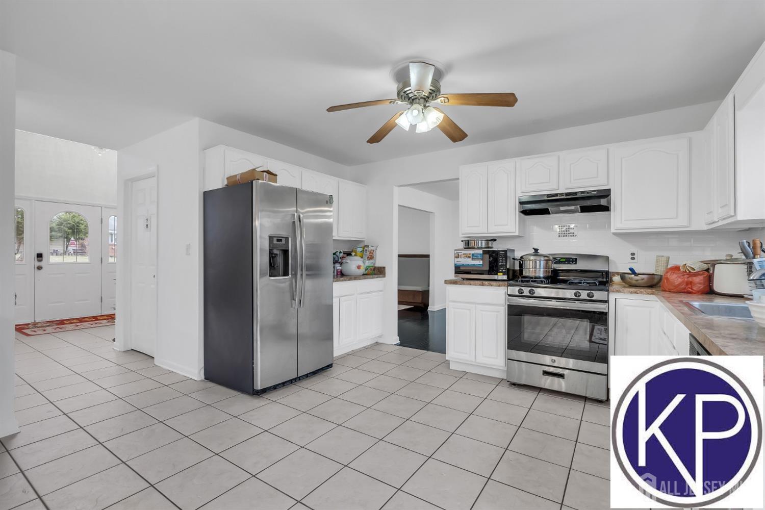 109 Jordan Road Colonia, NJ 07067 - Photo 11 of 30 a kitchen with stainless steel appliances granite countertop a refrigerator and a stove top oven