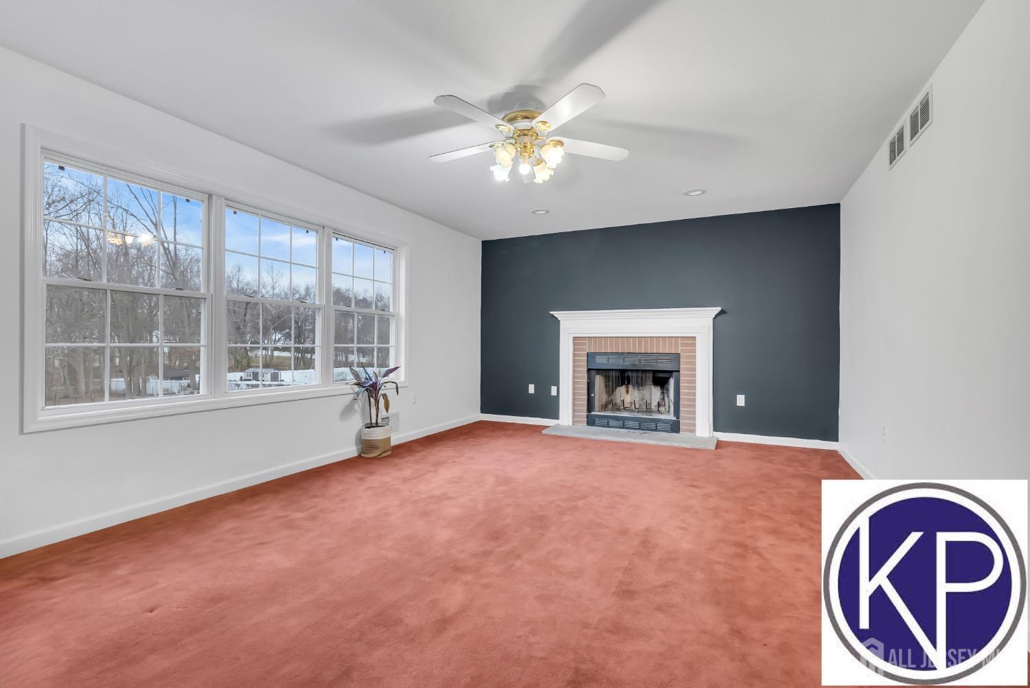 109 Jordan Road Colonia, NJ 07067 - Photo 14 of 30 a view of an empty room with a fireplace and a window